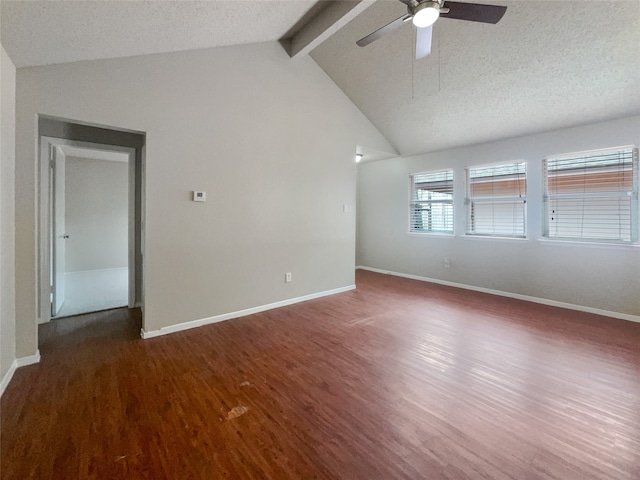 empty room featuring dark wood-type flooring, vaulted ceiling with beams, ceiling fan, and a textured ceiling