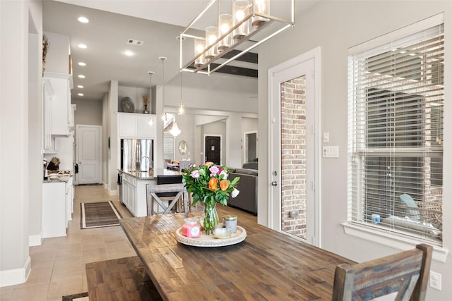 dining area featuring light tile patterned flooring