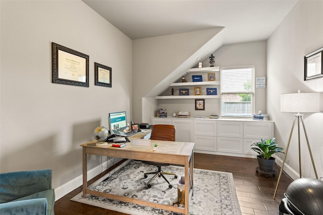 home office with dark hardwood / wood-style flooring