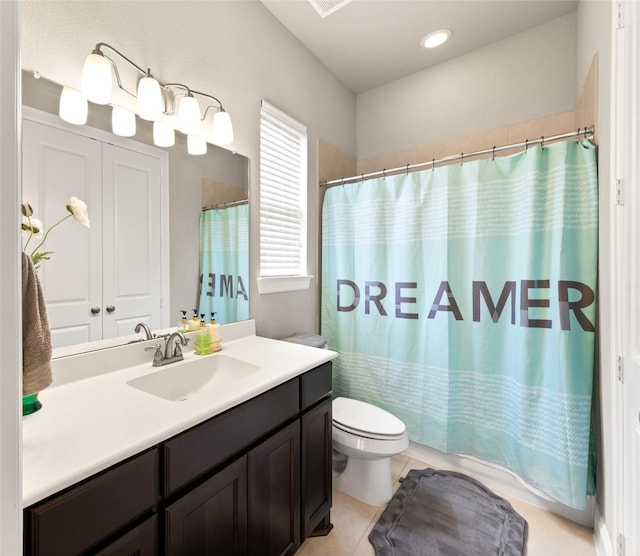 bathroom with tile patterned floors, vanity, and toilet