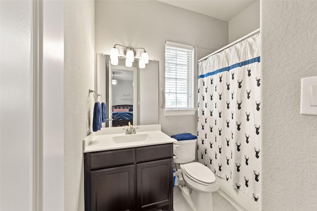 full bathroom with shower / bathtub combination with curtain, vanity, and toilet