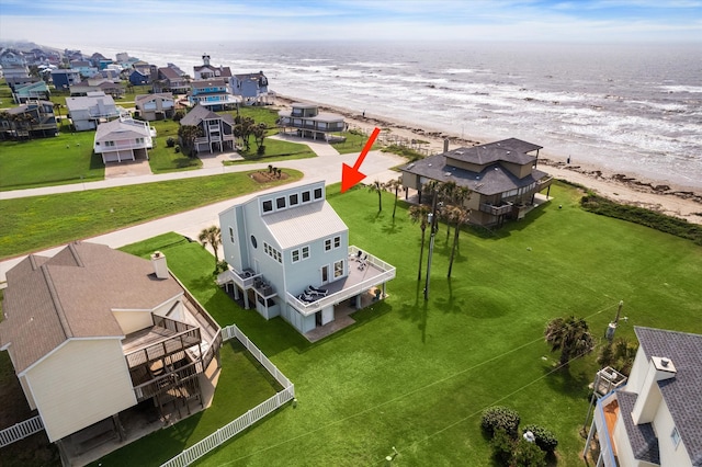 bird's eye view with a beach view and a water view