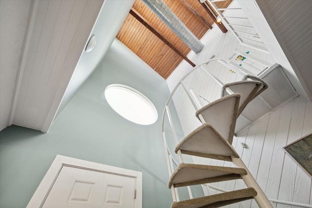 staircase with a towering ceiling