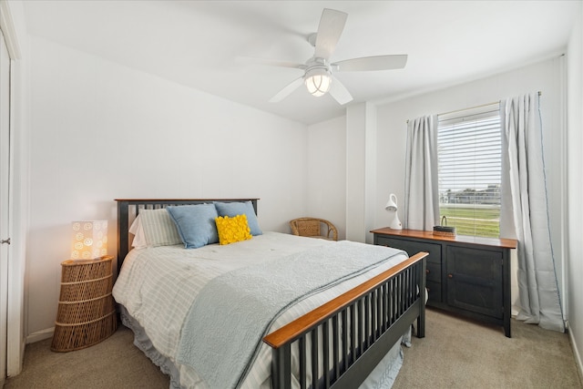 bedroom featuring ceiling fan and light colored carpet