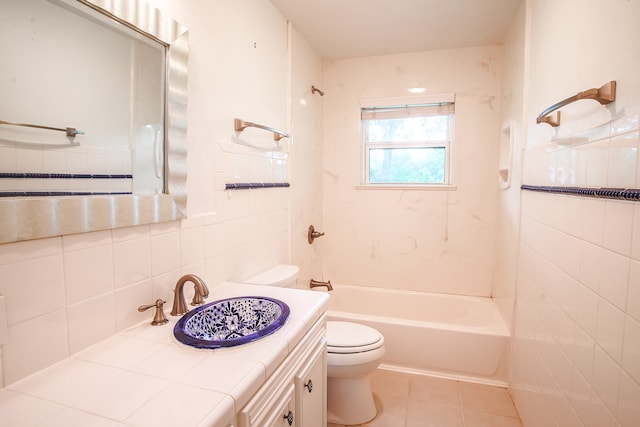 full bathroom featuring tile flooring, vanity with extensive cabinet space, toilet, and tile walls