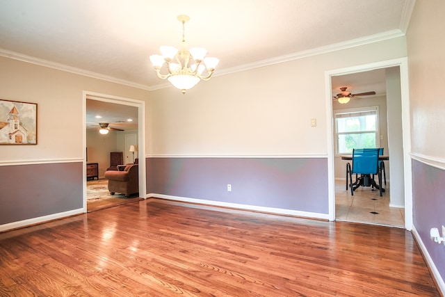 unfurnished room with wood-type flooring, ornamental molding, and ceiling fan with notable chandelier