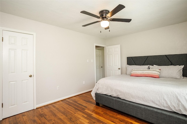 bedroom featuring baseboards, a ceiling fan, and wood finished floors