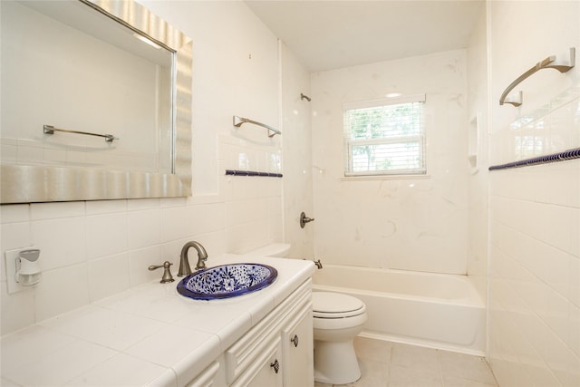 full bathroom with shower / tub combination, vanity, toilet, tile patterned floors, and tasteful backsplash