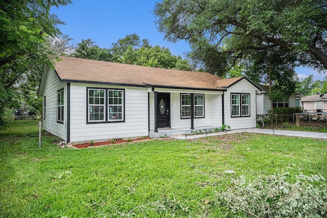 ranch-style house featuring a front lawn