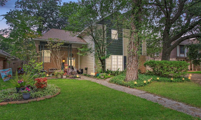 view of front of property with a yard