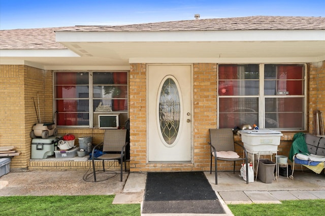 property entrance featuring cooling unit