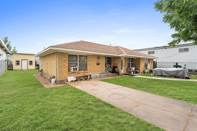 view of front of house featuring cooling unit and a front lawn