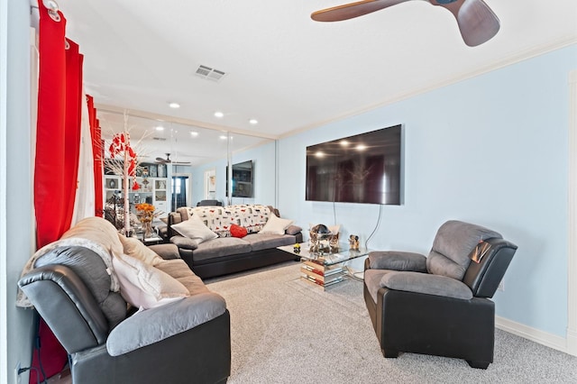 living room with carpet floors and crown molding