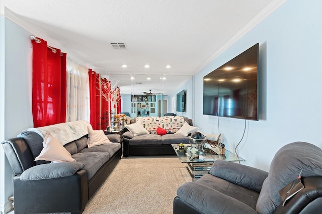 carpeted living room featuring ceiling fan and crown molding