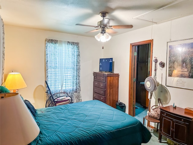 bedroom featuring ceiling fan and carpet flooring