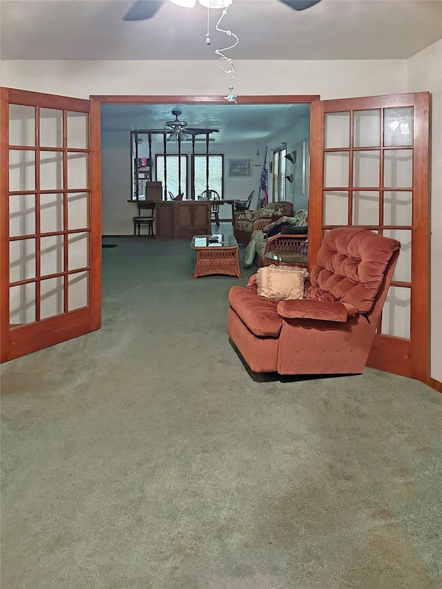 carpeted living room with ceiling fan