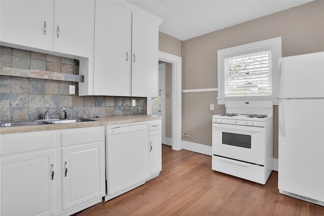 kitchen with backsplash, white cabinetry, white appliances, and light wood-type flooring