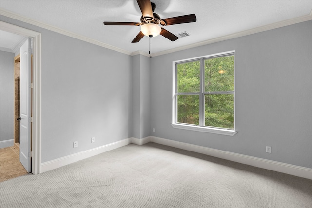 unfurnished room featuring light carpet, ornamental molding, and ceiling fan