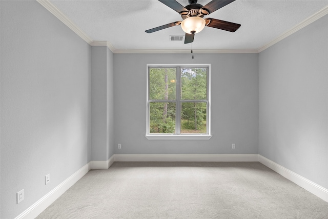 carpeted empty room featuring crown molding and ceiling fan