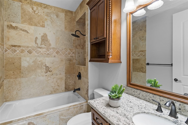 full bathroom with vanity, toilet, and tiled shower / bath combo