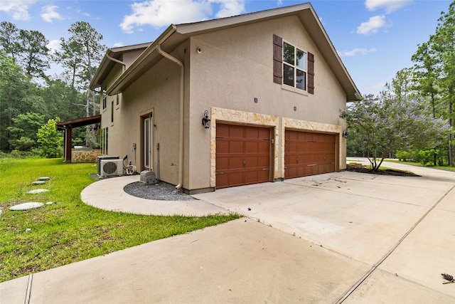 view of side of property with a garage, a lawn, and central air condition unit