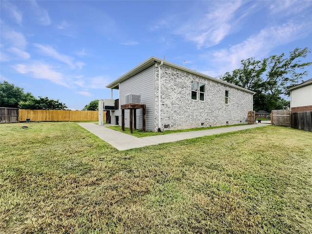 back of house with a yard