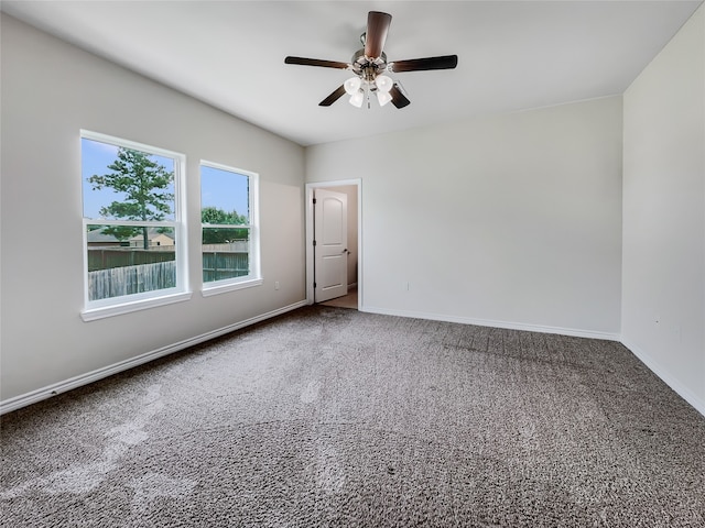 unfurnished room featuring carpet and ceiling fan