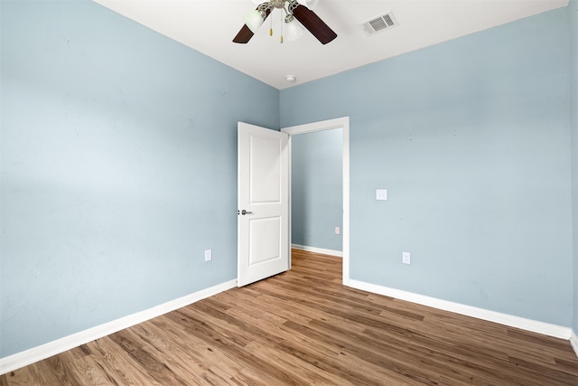 spare room featuring ceiling fan and wood-type flooring