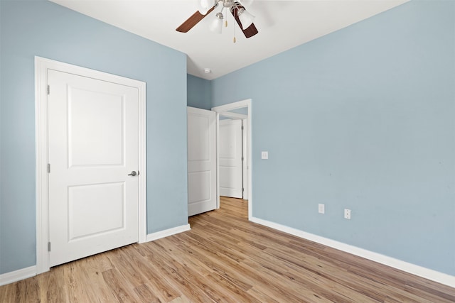 unfurnished bedroom featuring ceiling fan and light hardwood / wood-style floors