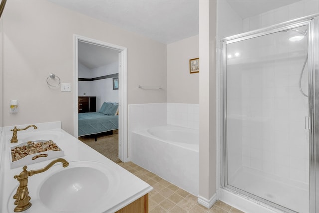 bathroom featuring independent shower and bath and vanity