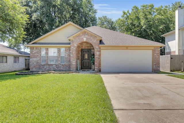 single story home featuring a garage and a front lawn