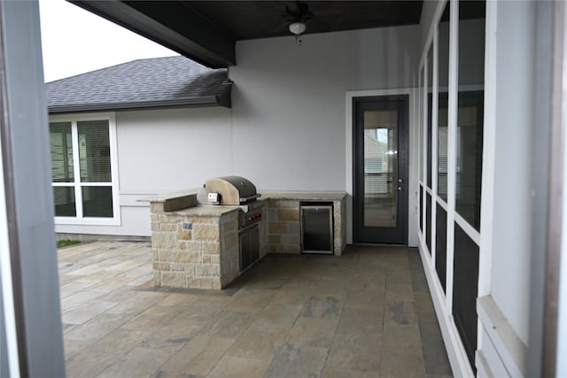 exterior space with a patio, exterior kitchen, and ceiling fan