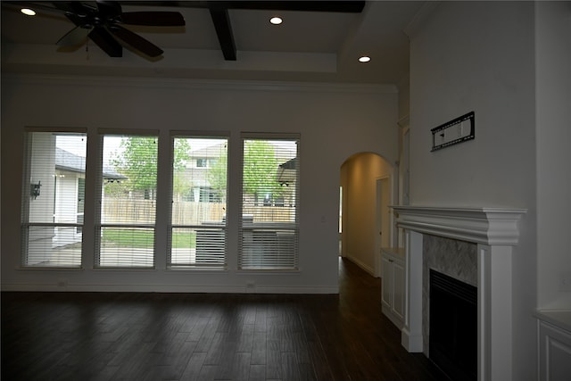 living room featuring dark wood-type flooring, ceiling fan, a fireplace, and crown molding