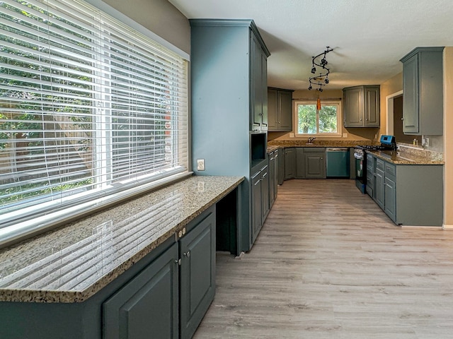 kitchen with gas stove, light hardwood / wood-style floors, dishwasher, and gray cabinetry