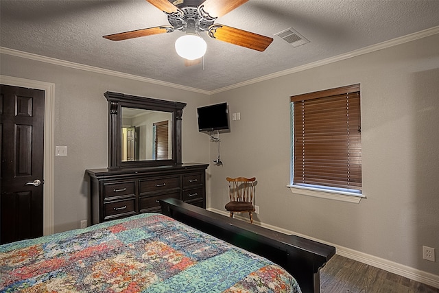 bedroom with ornamental molding, dark hardwood / wood-style floors, ceiling fan, and a textured ceiling