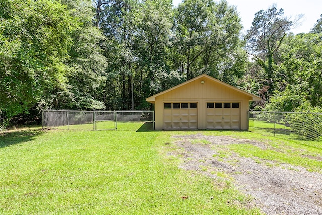 garage featuring a lawn