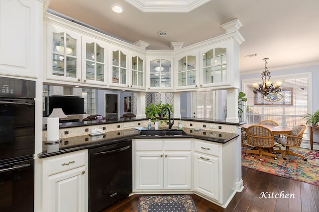 kitchen with sink, white cabinets, backsplash, and black appliances