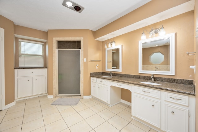 bathroom featuring walk in shower, tile flooring, and dual bowl vanity