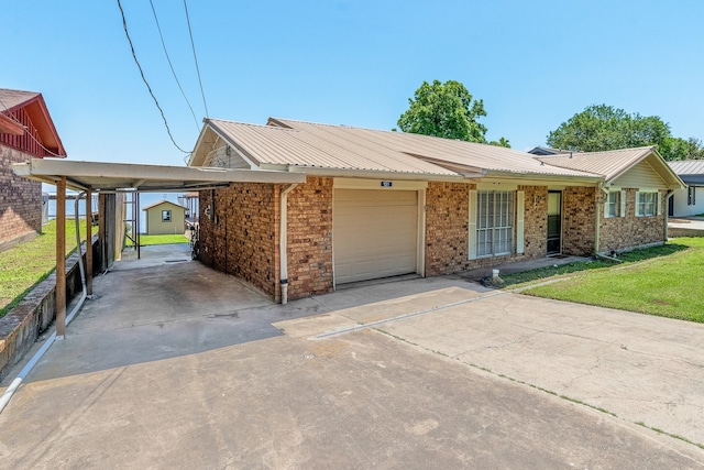 ranch-style home featuring a front lawn, a carport, and a garage