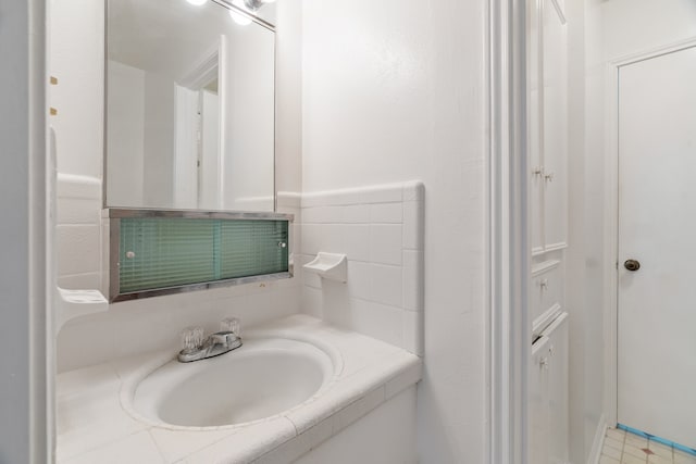 bathroom featuring tile patterned floors and vanity