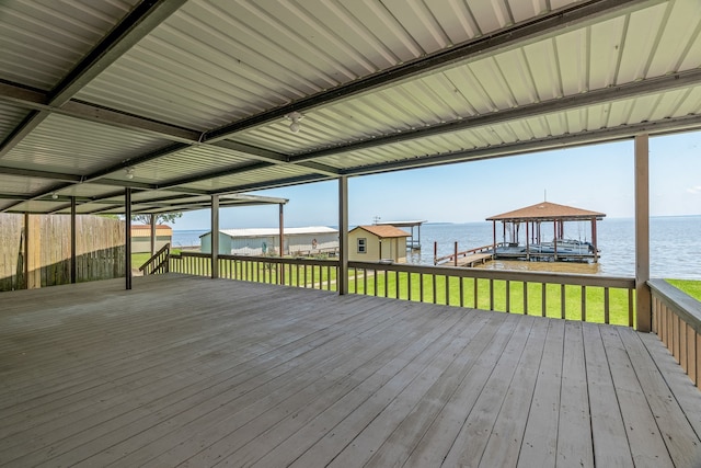 wooden terrace with a dock and a water view