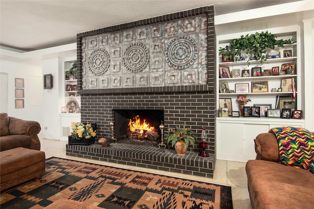 tiled living room with brick wall, a textured ceiling, and a fireplace