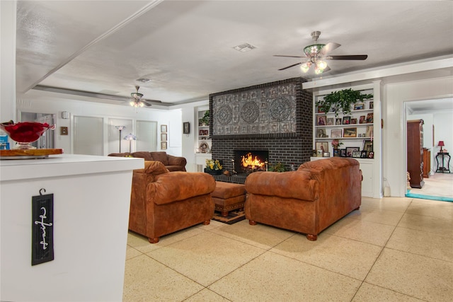 living room featuring brick wall, built in features, ceiling fan, and a fireplace