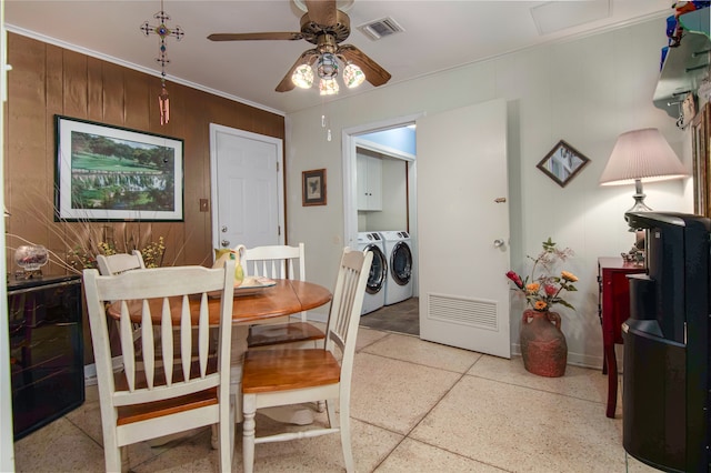 dining room featuring ceiling fan and separate washer and dryer