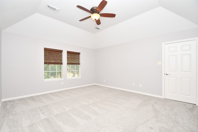 spare room featuring ceiling fan, carpet floors, and lofted ceiling