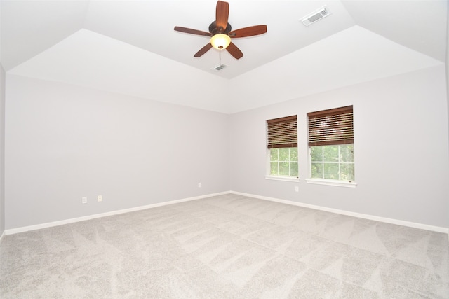 carpeted empty room featuring ceiling fan and vaulted ceiling