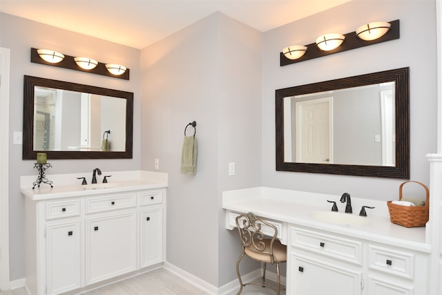 bathroom with tile floors, dual sinks, and vanity with extensive cabinet space