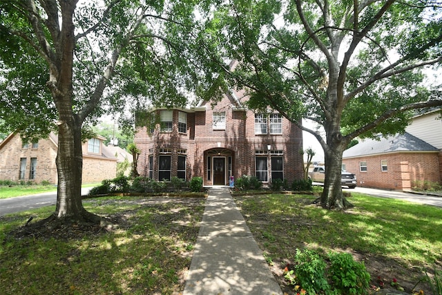 view of front of home featuring a balcony