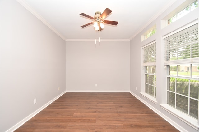 spare room with crown molding, dark wood-type flooring, and ceiling fan