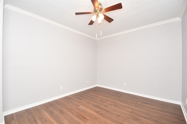 empty room with dark hardwood / wood-style flooring, ornamental molding, and ceiling fan